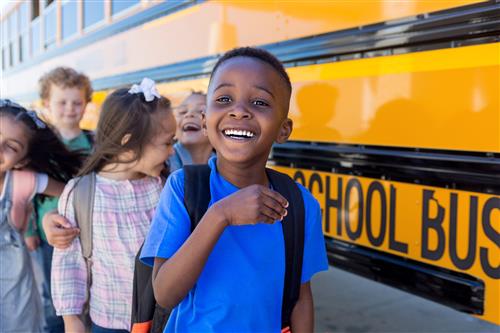 Students getting on bus